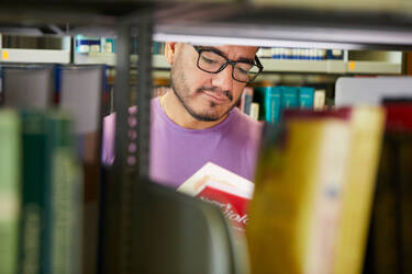 A doctoral student in the library